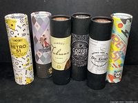 Six cylindrical gift tubes with Retro 51 Tornado packaging, each labeled with pen model names