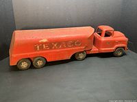 Side view of the full Buddy L Texaco toy tanker truck showing the length, shape, and prominent Texaco logo on the tanker section.