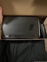 Top view of Bell Home Hub 3000 router in box with power adapter.