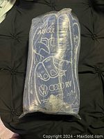 Pack of 8 foam hands wrapped in clear plastic, showing navy blue color and white logo outlines