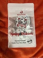 Front of packaging showing soccer sticker design and product branding