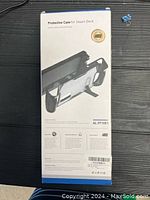 Box rear side showing product details and features of protective case AL-ST1001 for Steam Deck.