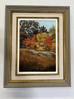 Front view of the framed oil painting showing the autumn landscape and signature on the bottom right corner.