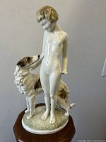 Full front view showing nude lady and borzoi dog on oval base