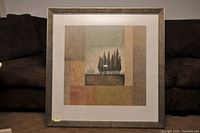 Framed print with abstract tree landscape and textured earth tone block patterns, showing overall condition and framing.