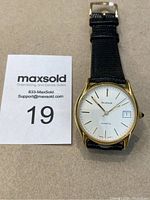 Full view of Birks men's quartz watch face and black leather strap