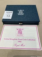 Official certificate of authenticity for the 1984 United Kingdom Proof Coin Collection from the Royal Mint, presented alongside the closed case.