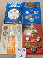 Four sets of Israeli coins in original presentation packaging.