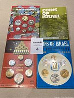 Four sets of Israel specimen coins on original cards; includes 1969 Jerusalem Specimen Set and others.