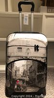 Front exterior of the hard shell ITLU carry on suitcase with Venice canal print and extended telescoping handle.