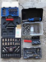 Full view of all tool sets, cases, and bits arranged for display.