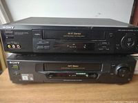 Two Sony VHS players stacked, SLV-778HF on top and SLV-640HF below, showing front panels and controls