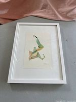 Frontal view showing entire framed watercolor artwork with white mat and frame.