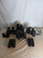 Overview photo showing all six binoculars grouping with various sizes and features.