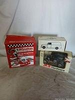 Three collectible cars in their original packaging, including Winston AM-FM headphone radio car, Ace Hardware black car model, and white delivery van model.
