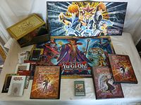 Overview of Yu-Gi-Oh items including Legendary Decks collector's box, playmats, and Duelist Card Boxes.