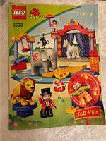 Box front image showing set artwork with all main characters and circus elements depicted.