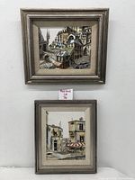 Two framed watercolor paintings on canvas displayed vertically, showing full lot contents.