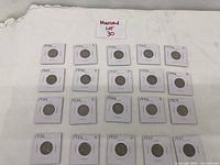 Image showing 17 Buffalo nickels in individual holders with dates between 1929 and 1937.