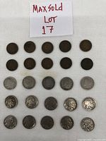 Overview of all 25 coins arranged in rows on a white background with handwritten lot note above.