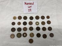 Photo of 38 assorted vintage circulated coins from different countries and years, some with holes in the middle and varying sizes.