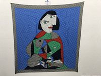 Front view of the silk scarf showing the full abstract female portrait design against a blue background with gray border.