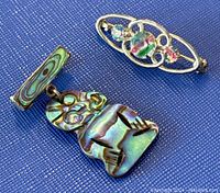 Two vintage sterling silver brooches, one with abalone shell pendant and one with colored glass stones.