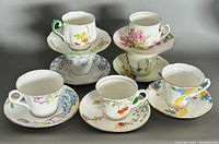 Seven teacups each paired with matching saucers featuring varied delicate floral patterns in multiple colors, stacked and arranged in two photos.