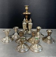 Group shot showing all nine items against dark background