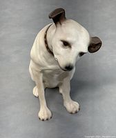 Front view of the RCA Nipper dog figurine showing sitting pose and facial expression.