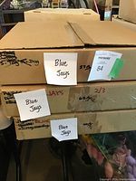 Stacked cardboard boxes labeled 'Blue Jays' containing collection of cards