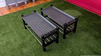 Two IKEA TJUSIG shoe racks side by side on green carpet, showing overall condition and trays on top