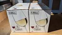 Two unopened Libbey Elation wine glass sets in boxes, each containing 8 glasses, total 16 pieces.