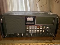 Front view showing speaker, signal strength meter, keypad and tuning knob