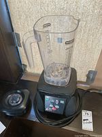 Blender base with pitcher and lid assembled on countertop