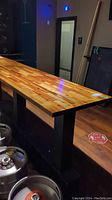 Full view of the wooden table top with polished multi-toned wood surface.