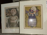 Photo showing both framed lithographs side by side, each 20x16 inches with matting and thin metallic frames.