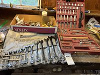 Wrench set close-up displaying all 13 wrenches from 1/4" to 1" sizes, black oxide finish.