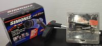 Simoniz Cyclone Powerspin multi-cleaning tool with box and handheld cleaning accessory.