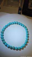 Top view of the natural turquoise stretchy bracelet showing round turquoise beads in robin's egg blue color with natural veining.