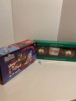 Photo of North Pole Express plastic train set box with winter holiday theme and description of train model
