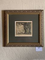 Framed artwork showing entire piece including frame, mat, and etching