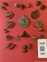 Full collection displayed on red background showing all pins and badges grouped together.