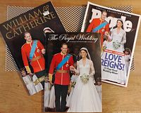 Three magazines laid out showing covers with Prince William and Catherine Middleton's wedding images.