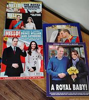 Five Hello! Canada magazines showcasing Prince William and Kate Middleton across different events like their wedding, royal visit to Canada, and baby announcement. Displayed on wooden floor.