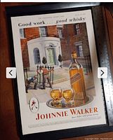 Photo showing the original vintage Johnnie Walker whisky advertisement print featuring a workmen scene and whisky bottle and glasses, with a measuring ruler beside for scale.