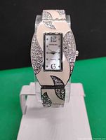 Front view of the Persona quartz watch showing rectangular face with silver-tone and rhinestone decorated band.