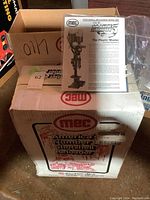 Overview of two MEC boxes with instruction manual on top