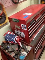 Top and side views of red Remline Pro Series tool box with Quadratec branding and multiple stickers; drawers visible.