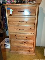 Front view of the tall six-drawer solid wood dresser.